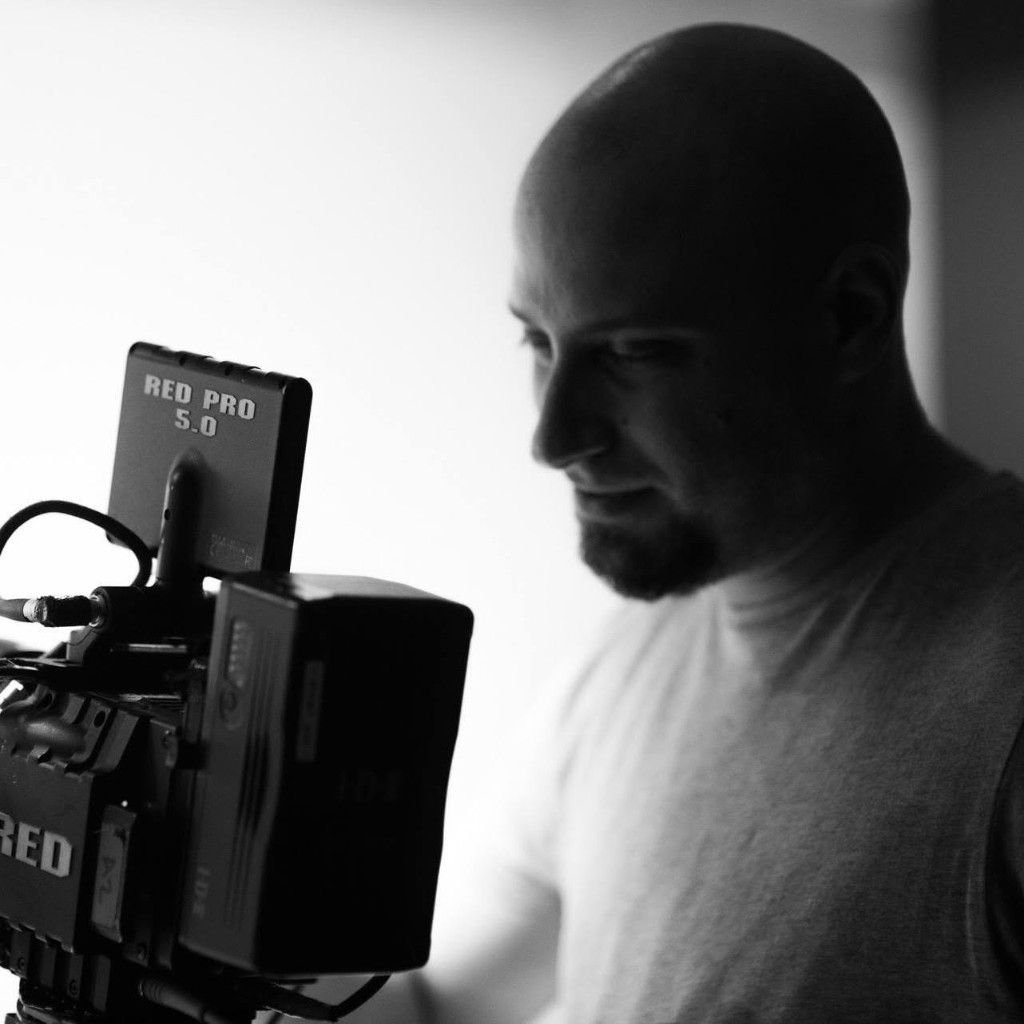 Amit Edelman operating a cinema camera on set